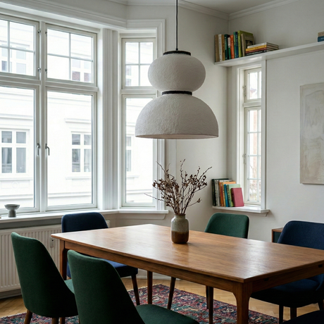 Textured pendant above a table in a bay window room
