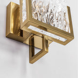 Close view of the brass frame corner around the glass panel