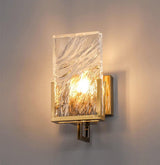The glass panel lit warm on a beige wall, its rippled surface glowing