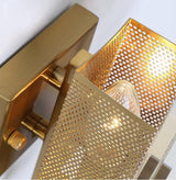 Close view of the perforated brass shield behind the glass