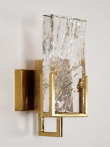 The sconce seen from the side, showing the frame and the backplate
