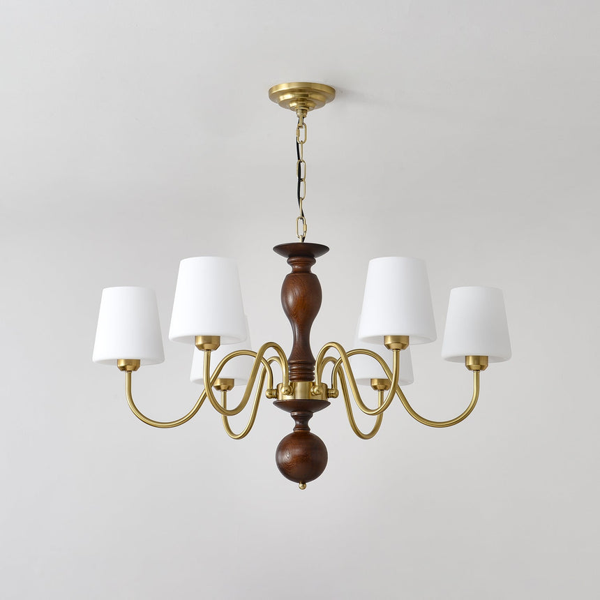 The turned walnut column with its ball finial and brass collar