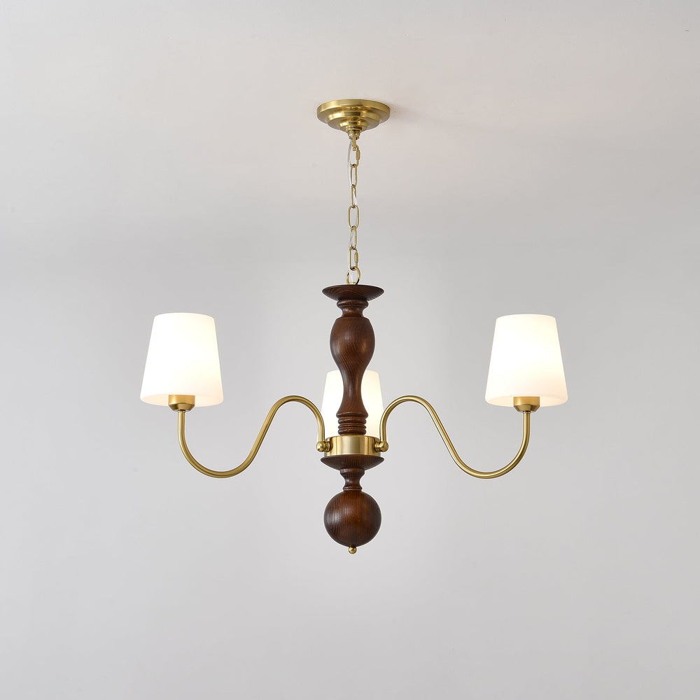 Three light chandelier with white fabric cones on a walnut column