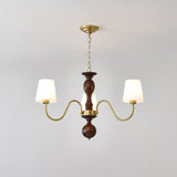 Three light chandelier with white fabric cones on a walnut column