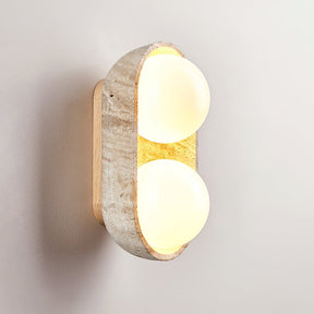 The short shell lit with two orbs glowing inside the carved stone rim