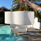 Two tier drum shade seen in daylight against open sky