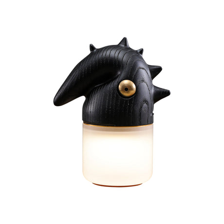 Black touch control bedside lamp lit, seen at an angle