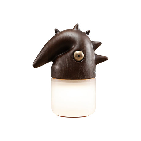 Walnut touch control bedside lamp lit, seen at an angle