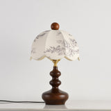 Scalloped toile shade lamp unlit, the printed pattern clearly visible