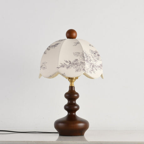 Scalloped toile shade lamp unlit, the printed pattern clearly visible