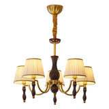 The five light build, arms fanned around the tapered walnut column