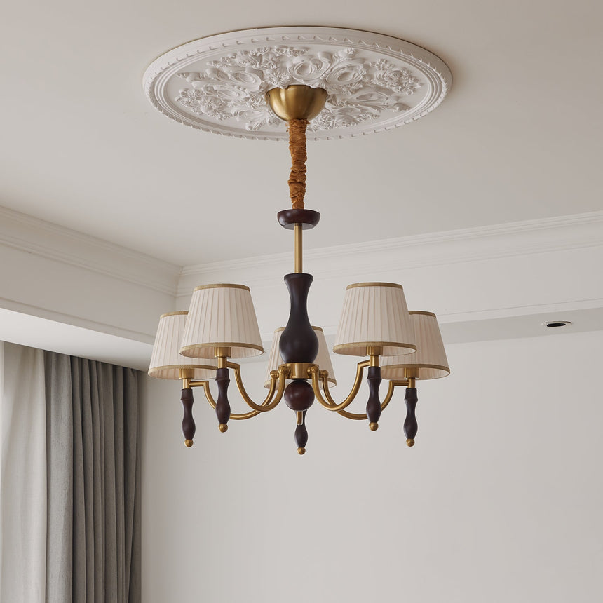 Small pleated fabric shades and the walnut drops at the arm tips