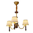 Three light chandelier with pleated shades on a walnut column