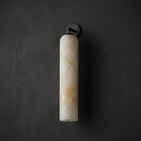 The matte black version glowing warm against a dark wall