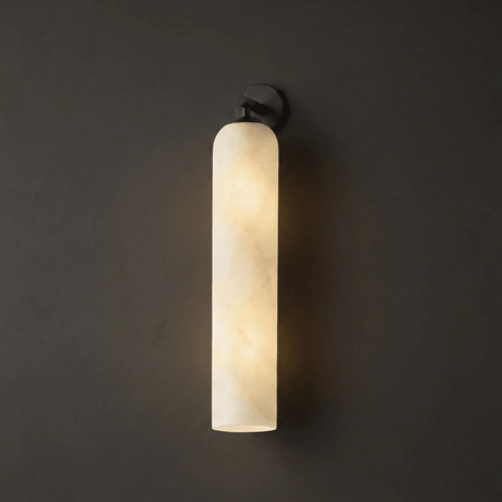 The stone column lit, the natural veining showing through the light