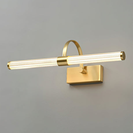 The brass version lit, a ribbed tube glowing under a small polished arch