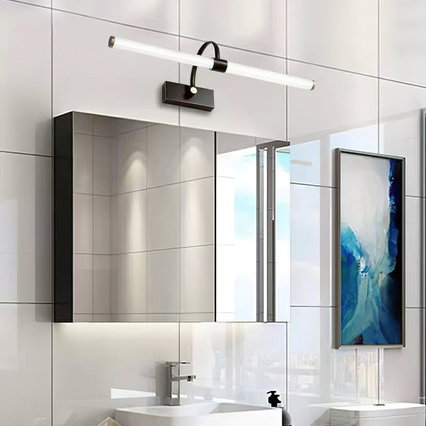 Dark arch and tube lit above a mirror cabinet in a tiled bathroom with a window