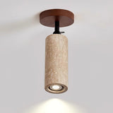 The same travertine tube mounted on a ceiling and aimed straight down