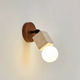 Open round bulb glowing at the end of a travertine tube on a wall