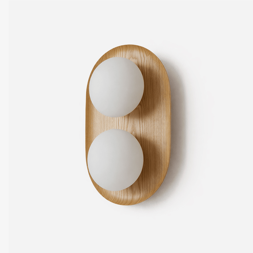 Two light wall sconce, a wood capsule holding two opal glass globes
