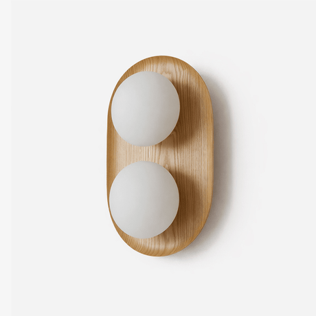 Two light wall sconce, a wood capsule holding two opal glass globes