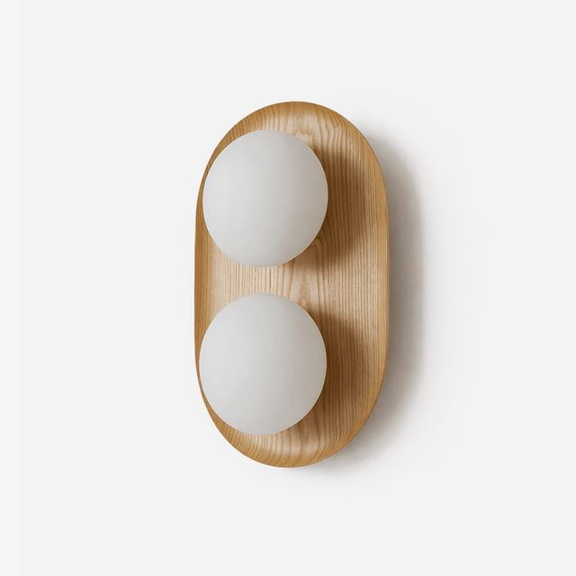 Two light wall sconce, a wood capsule holding two opal glass globes