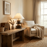 Unique table lamp on a rustic bench in a pale living room