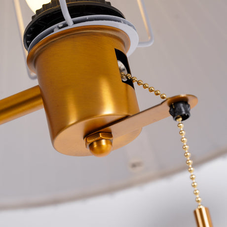Close view under the shade showing the brass socket and its pull chain