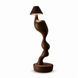 Cordless table lamp in dark wood seen from the front, plain background