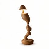 Cordless table lamp in light wood seen from the front, plain background