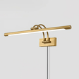 The brass version seen at an angle, twin arms carrying the tube clear of the plate