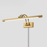 The brass version seen at an angle, twin arms carrying the tube clear of the plate
