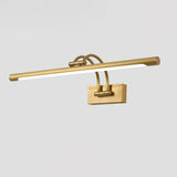 The brass tube lit along its length, the diffuser bright between the two arms