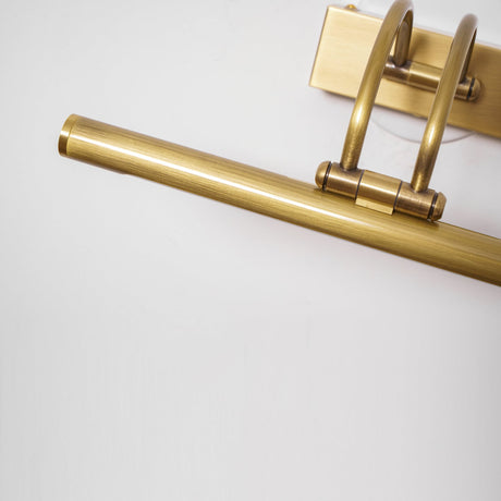 Close view of the brass tube end, the arched arms and the plate behind them