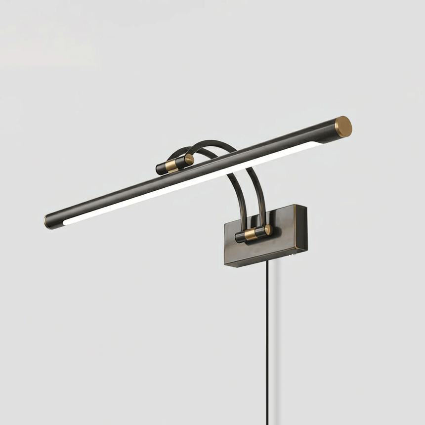 The dark bronze version seen at an angle with the cord dropping from the wall plate