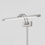 The nickel version seen at an angle, a pale tube on two arms with the cord hanging