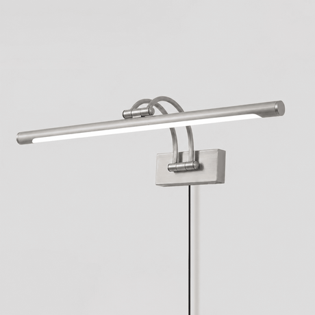The nickel version seen at an angle, a pale tube on two arms with the cord hanging