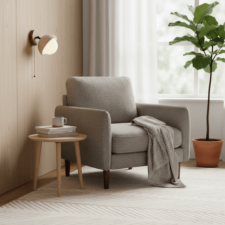 Single dome lit above a small side table beside an armchair and a plant