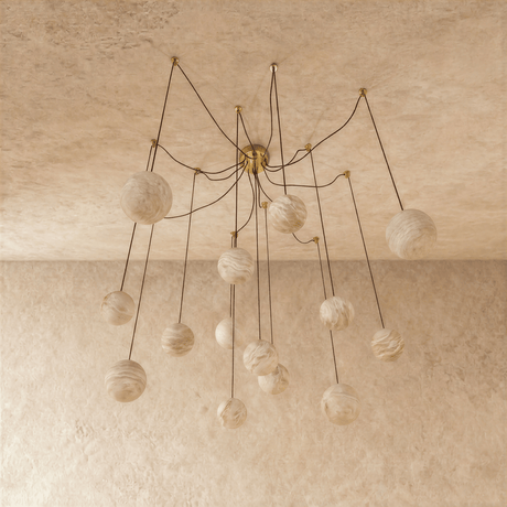 The globes unlit on brass arms, each stone sphere on its own curved stem