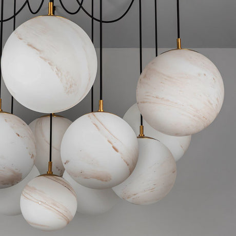 Alabaster globes unlit and clustered, each one held by a small brass fitting