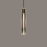 Close view of the lit crystal glass tube under its copper cap
