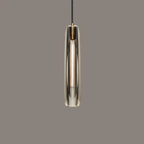 Close view of the lit crystal glass tube under its copper cap