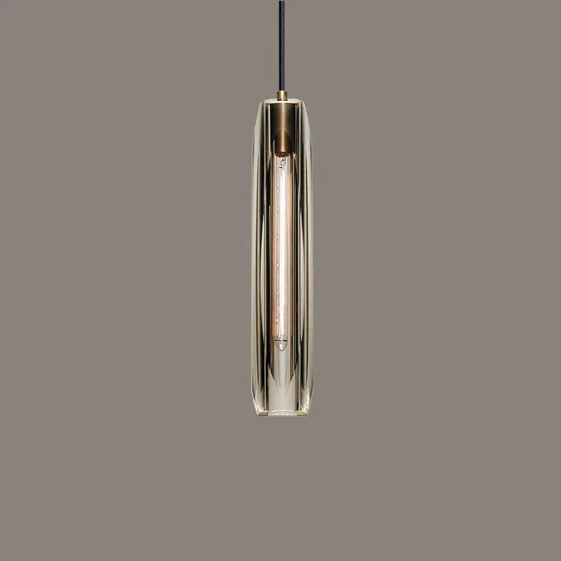 Close view of the lit crystal glass tube under its copper cap