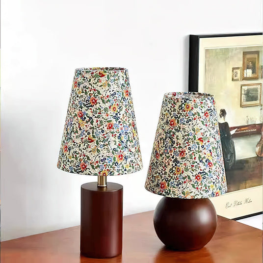 Both models side by side, one on a cylinder base and one on a sphere