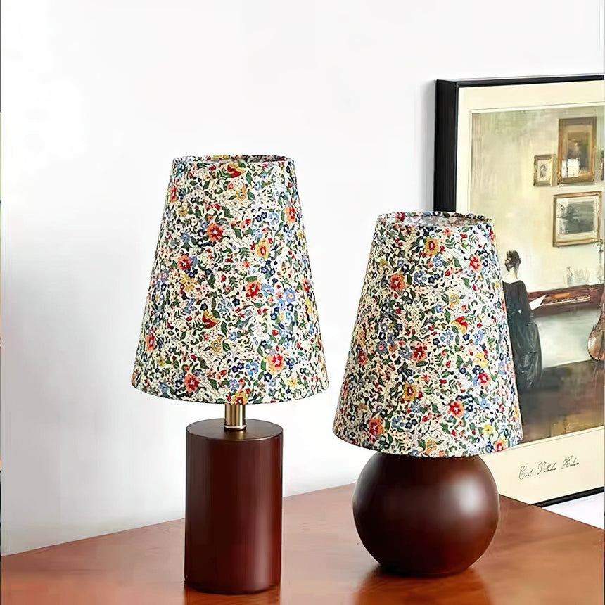 Both models side by side, one on a cylinder base and one on a sphere