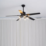 Black ceiling fan with glass globes near a curtained window