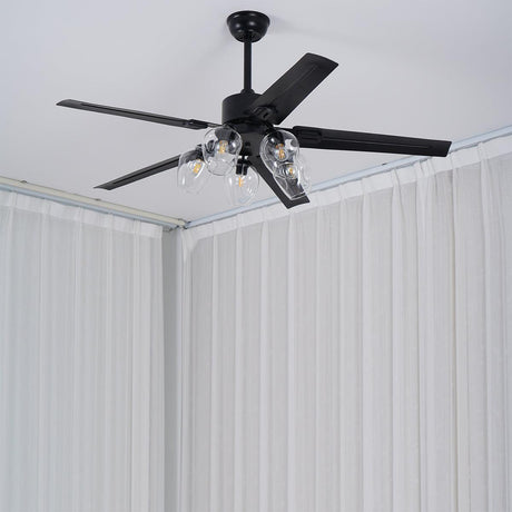 Black ceiling fan in a corner of a room with white curtains
