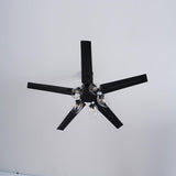 Black ceiling fan seen from below with the lights off
