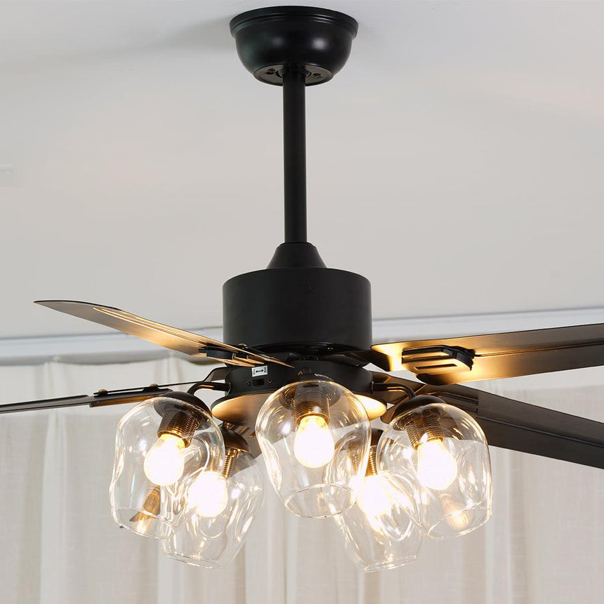 Black ceiling fan with lit globes beside a window