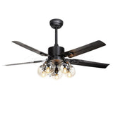 Black ceiling fan seen at an angle against a pale wall